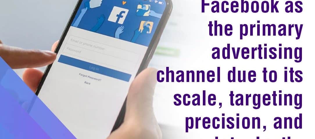 Hand holding a smartphone displaying the Facebook login page.